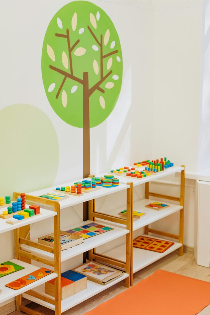 pexels-photo-8923952-8923952 Brightly colored educational toys neatly arranged on open shelves in a kindergarten classroom.